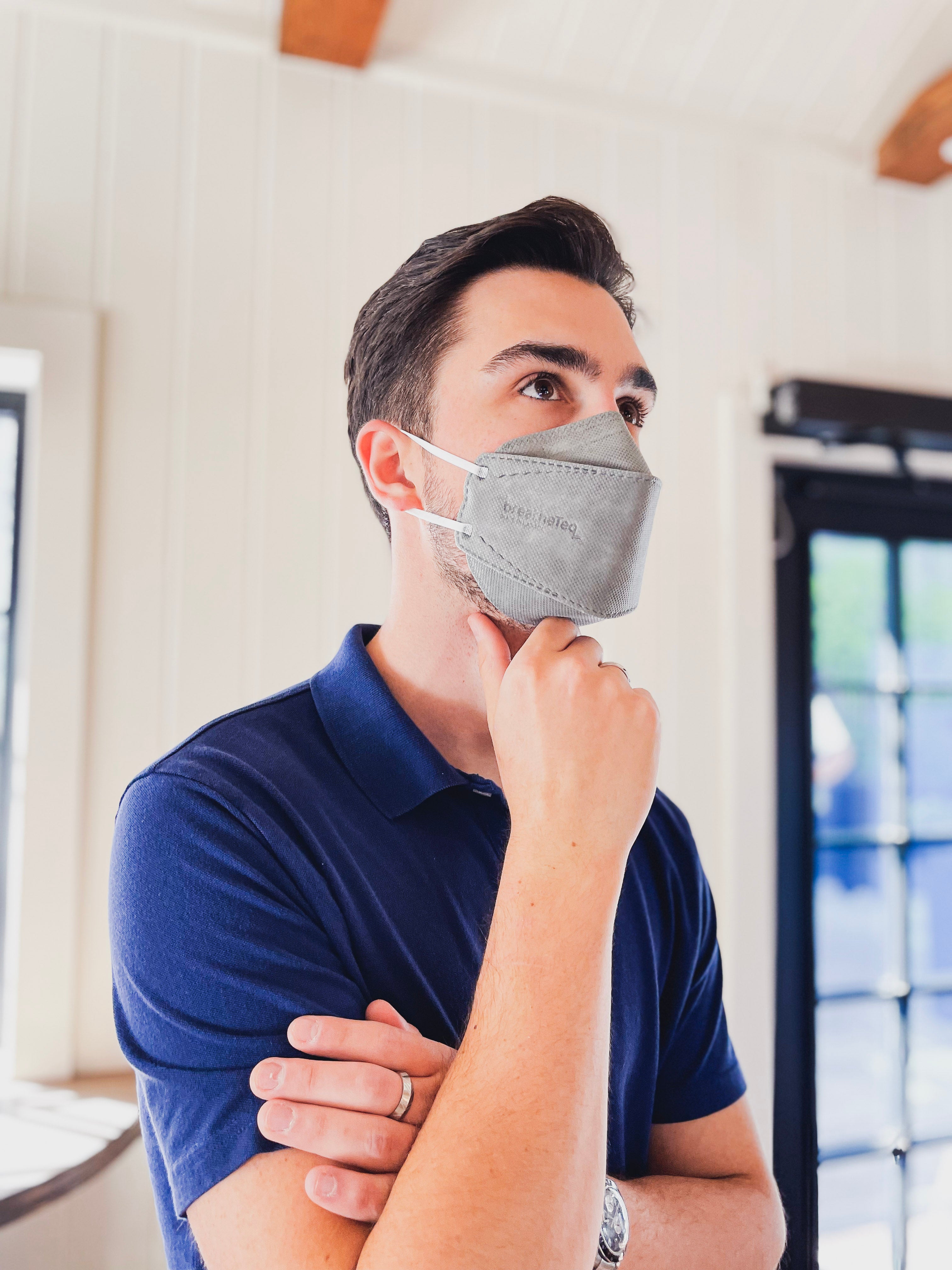 Man wearing BreatheTeq KN95 large grey Canada Masq respirator mask made in canada