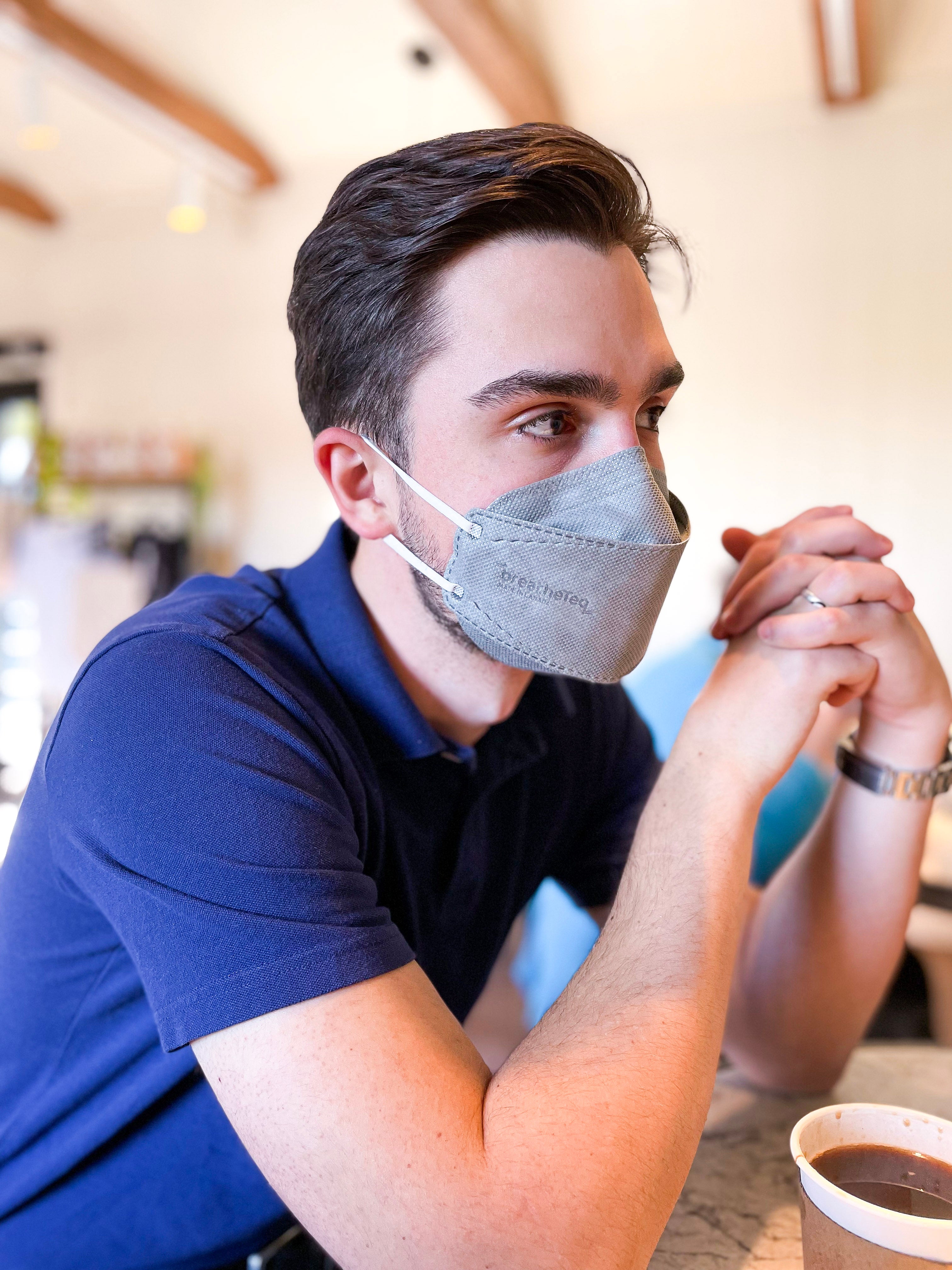 Man wearing grey breatheTeq KN95 mask made in Canada