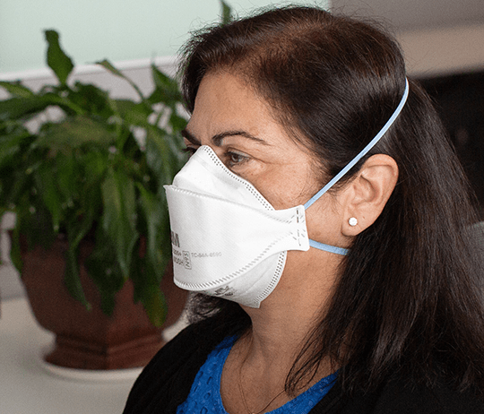 Woman in Canada wearing 3M Aura NIOSH N95 face mask 9205