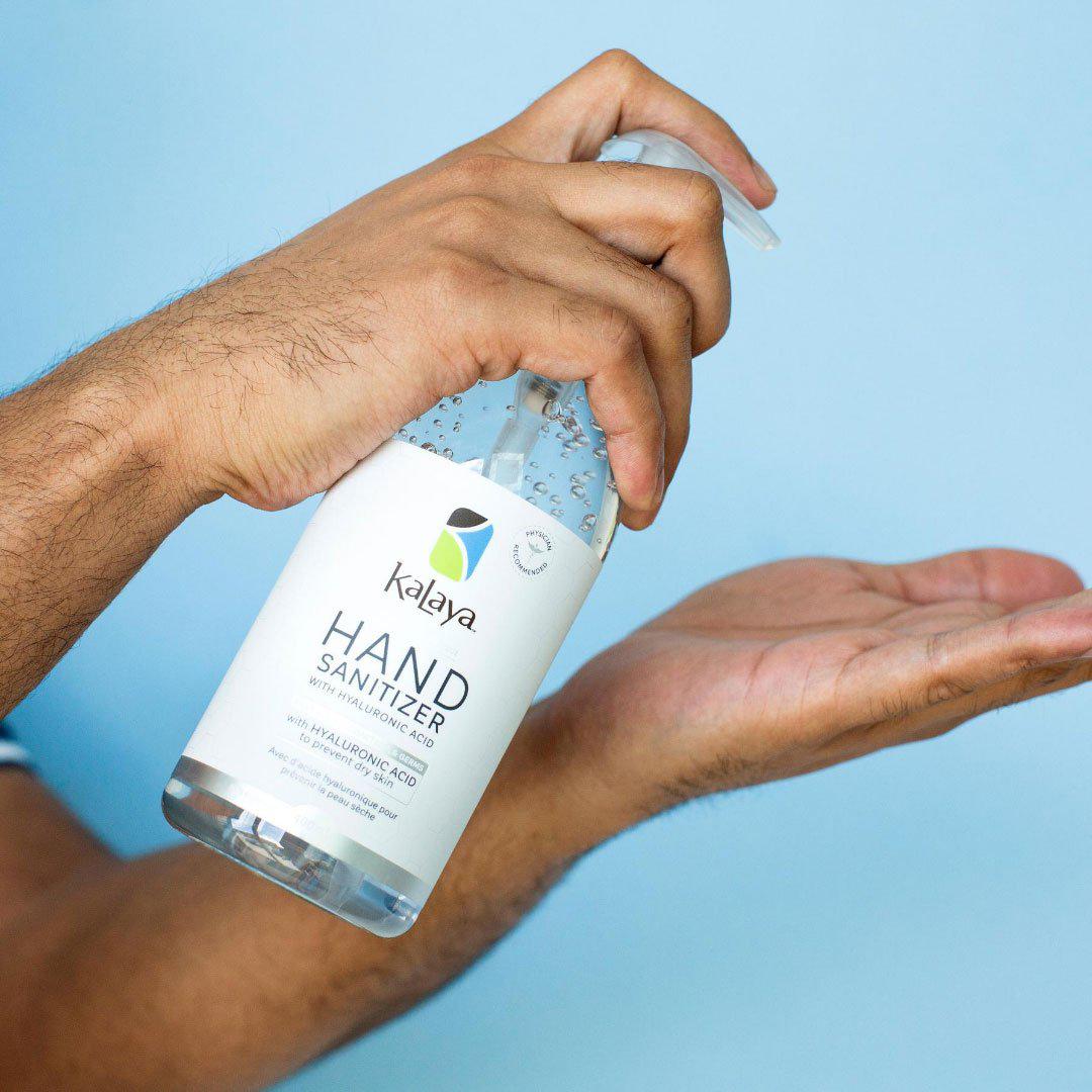 Canadian person applying 400mL Kayala hand sanizier to hands to moisturize and sanitize hands
