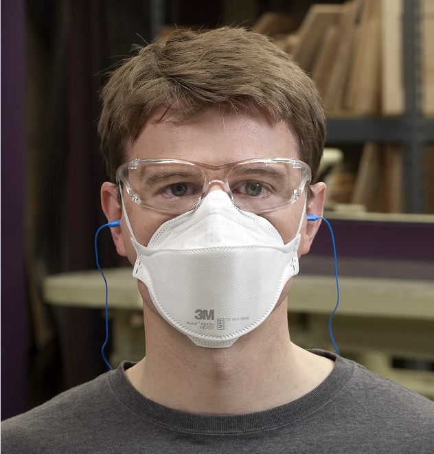 Man wearing 3M Canada 9210+ Aura N95 respirator in factory for construction on job worksite