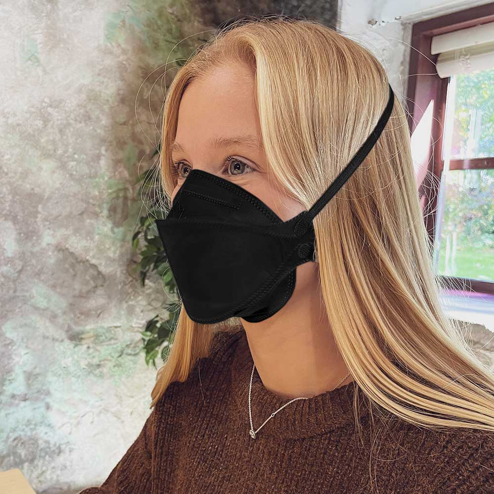 Woman wearing Vitacore CAN99 Black N95 style headband respirator mask from Canada Strong Masks
