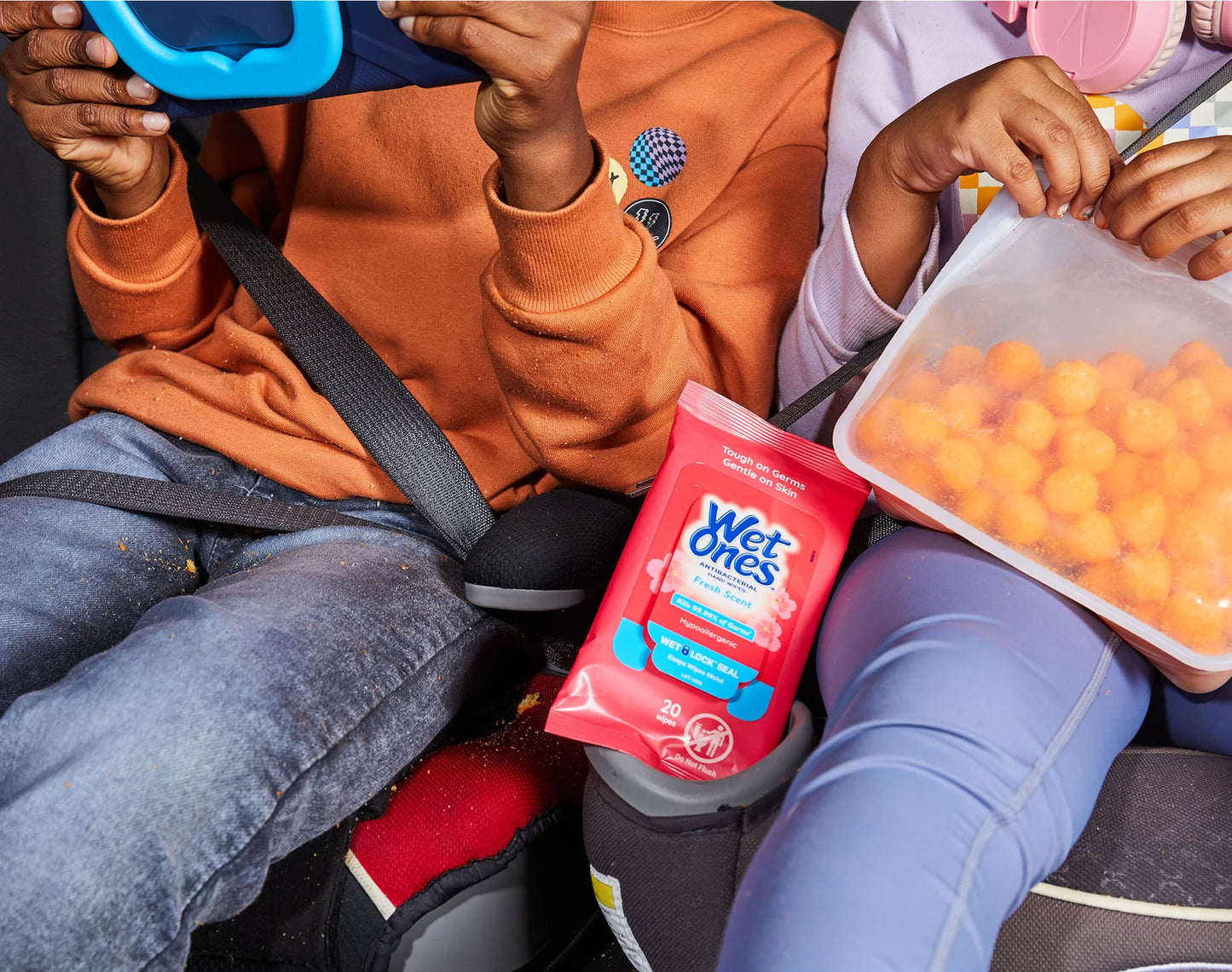 Canadian kids travel eating lunch in car with wet ones antibacterial hand wipes