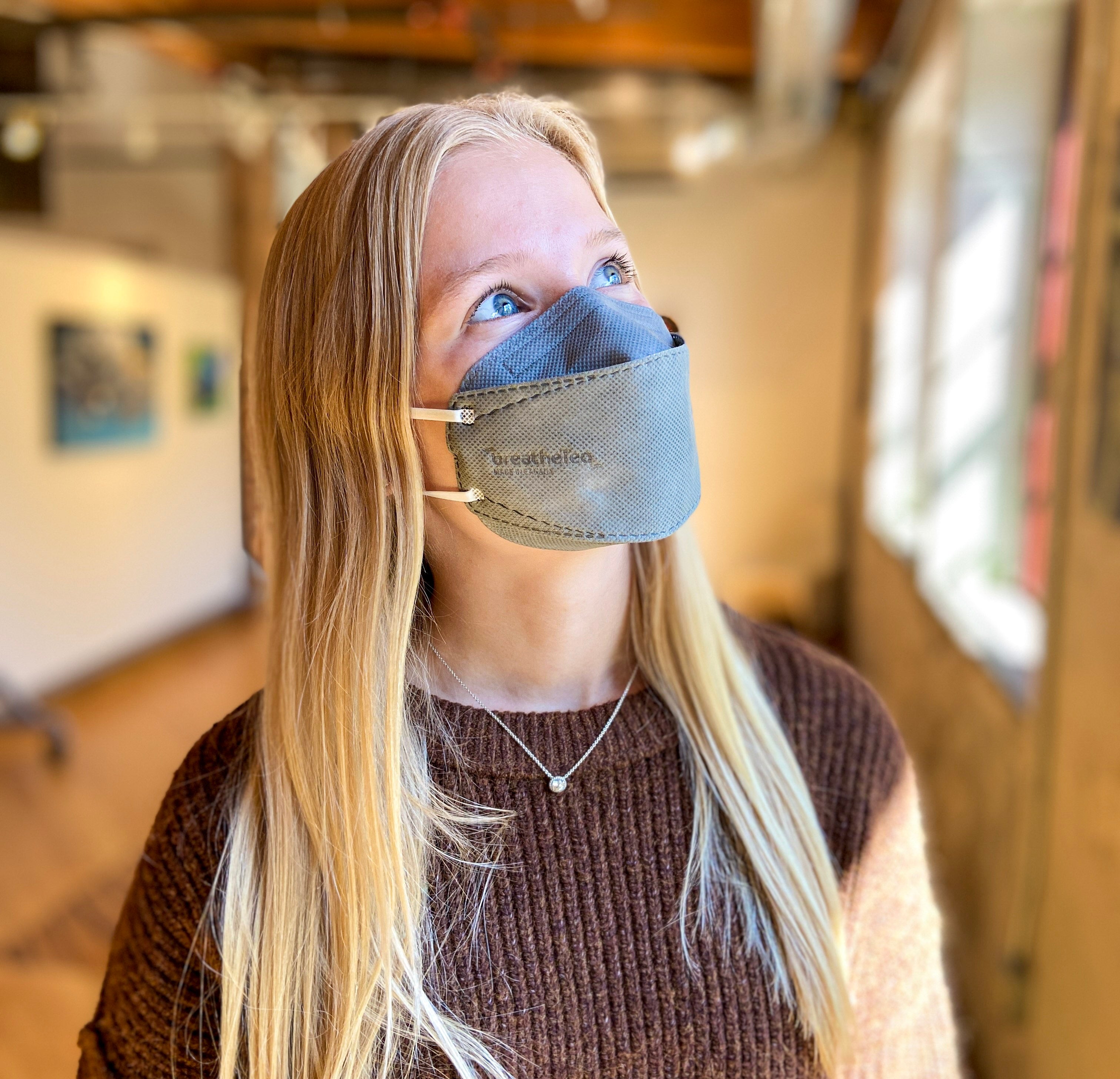 Young woman teen petite wearing BreatheTeq KN95 small grey Canada Masq respirator mask made in canada