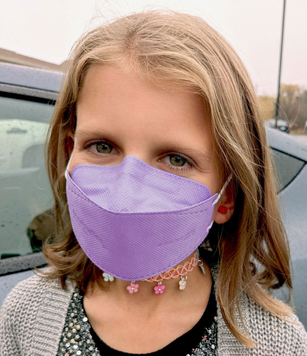 Child wearing BreatheTeq KN95 kids XS purple lavender Canada Masq respirator mask made in canada