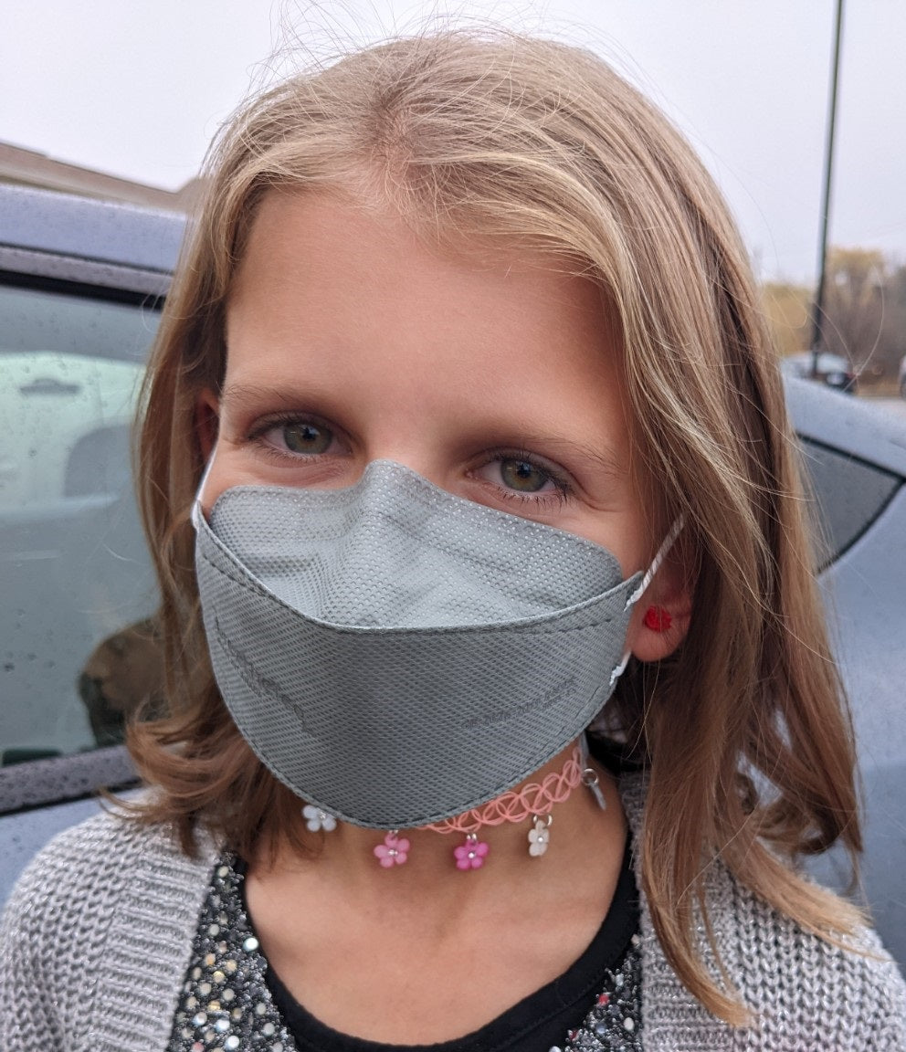 Child wearing BreatheTeq KN95 kids XS grey Canada Masq respirator mask made in canada