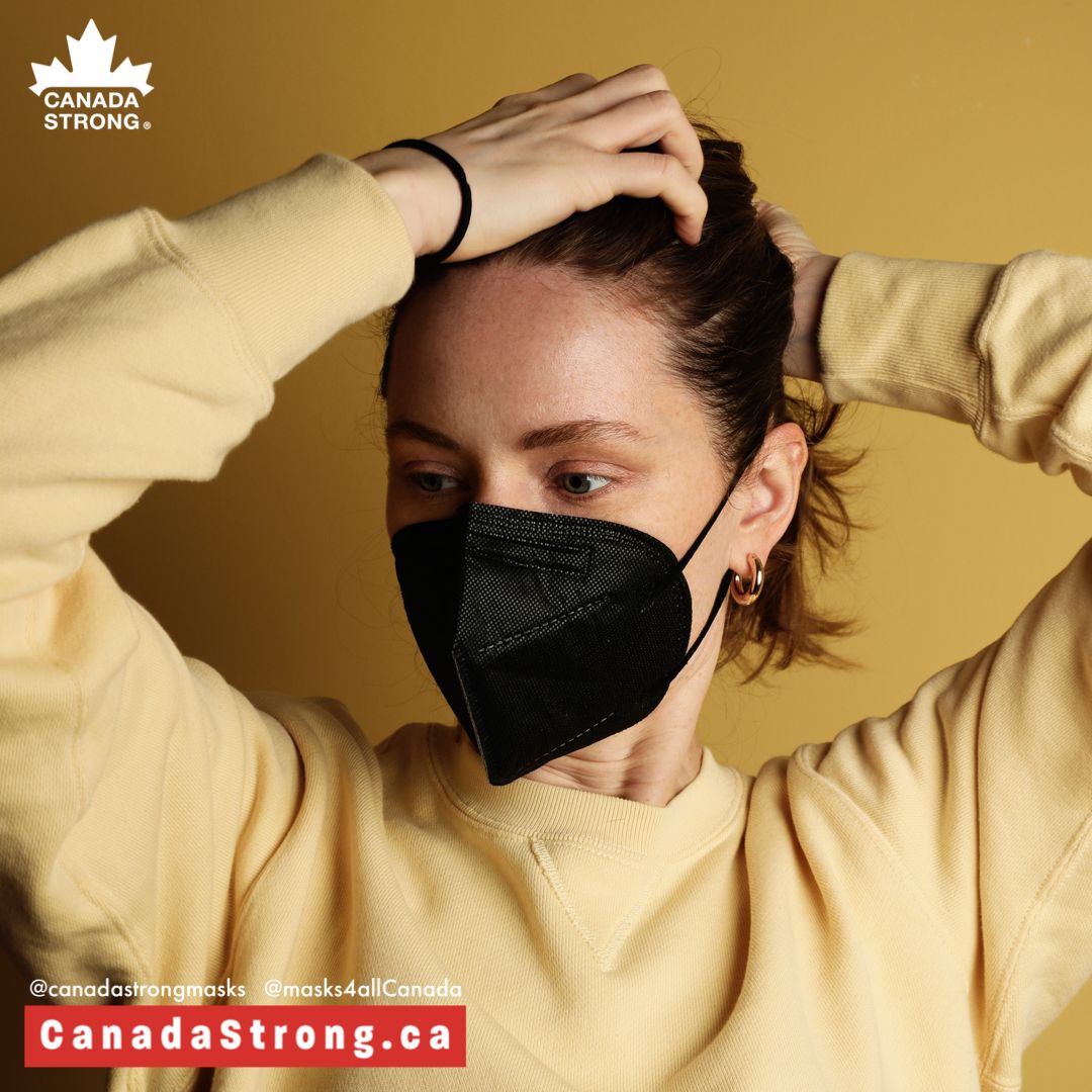Woman wearing black KN95 earloop mask Made in Canada Layfield Strong