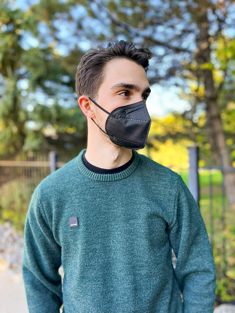 Man wearing black CAN95 Canadian respirator mask like Justin Trudeau